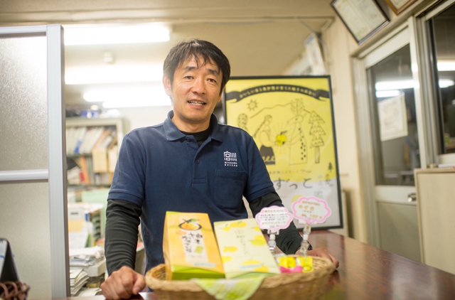 Photo of Mr. Tamura and his products