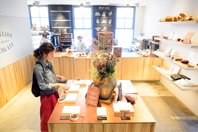 Irene tasting chocolate in the shop