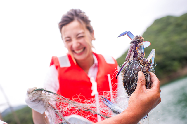 Irene catches a blue crab