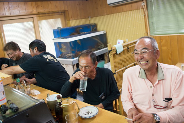 Fishermen joking with the chefs