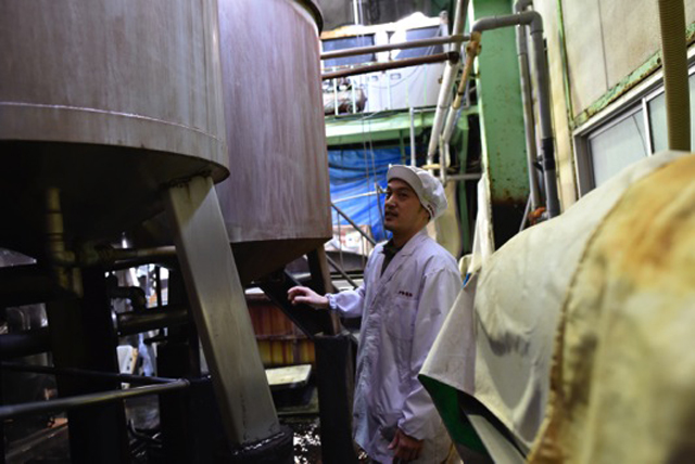 Shop foreman Kitamura woking on the shop floor